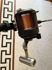 Mulinello Okuma Titus 20 lbs con filo in nylon nuovo 350m