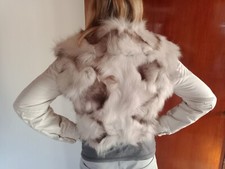 pelicia donna diesel, corta, colore bianca e grigia.  Con le maniche in tessuto