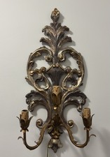 Applique in legno dorato e
