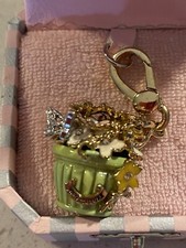 Juicy Couture hanging flower pot with butterfly’s in a light green pot