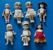 Lotto 7 bambole antiche