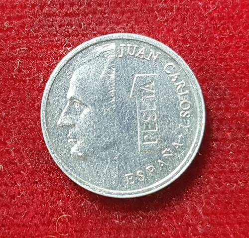 Una pta pesetas - 1,