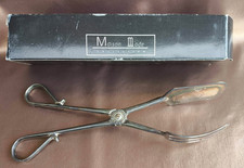 Couvert de service en métal