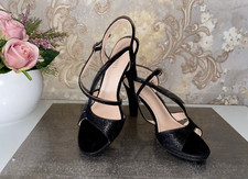 Scarpe nere scintillanti tacco