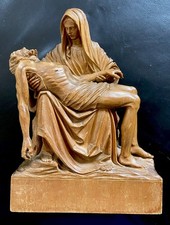 Antica statuina sacra in legno