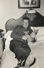 1950s Man in Bed Holding