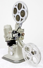 Proiettore pellicola cinematografica Bell And Howell 613H 16 mm + custodia e bobine abbinate, ART DECO