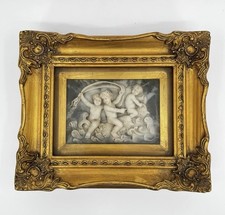 Cherubini con cornice in legno