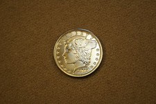 Daniel Carr 2012 USNA One Trade Dollar finitura satinata in ottone