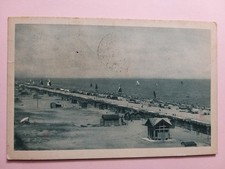 Riccione (Rimini). Sfilata di cabine e tende al mare.