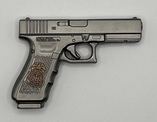 Distintivo agente pistola