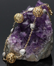BRACCIALE DA DONNA CON PALLINE IN ORO GIALLO E BIANCO  750/1000. ,  18 KT