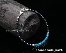Spinello nero + topazio blu