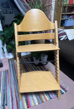 Seggiolone con schienale alto