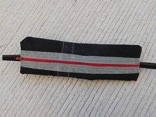 astuccio artigianale fatto con vela kitesurf nero grigio rosso