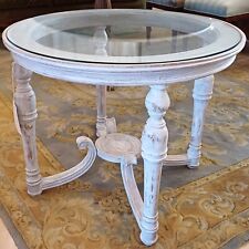 Tavolino rotondo con piano in cristallo