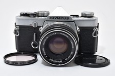 [Ecc+4] Olympus OM-1