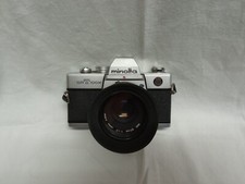 Fotocamera Minolta SRT100X con obiettivo  f/1.7 50mm + filtro PERFECT SKY 49mm