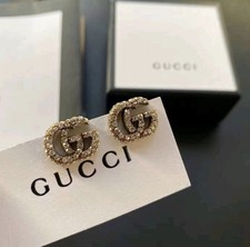 Gucci orecchini tono oro con pietre