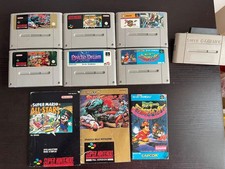 giochi super nintendo tra cui Donkey kong Country, street fighter II, adattatore