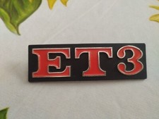 Rear frame frieze badge for