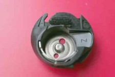 Capsula bobina per macchine da