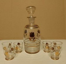 ?  Servizio da liquore,bottiglia + 6 Bicchierini (finitura Oro)  anni '70