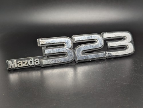Mazda 323 logo sigla emblema - 323,