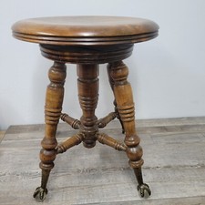 Antico sgabello pianoforte con