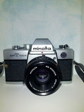 MINOLTA SRT100x+50mm f.1,7 - 1977 CON BORSA E FLASH OSRAM BCS25 SU RICHIESTA 