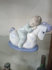 Statuetta in porcellana Lladro Nao BIMBO  CON IL CAVALLINO DEI MIEI SOGNO ANNI 2