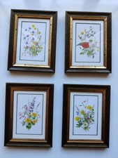 Four paintings with prints of