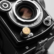 Coperchio pulsante otturatore