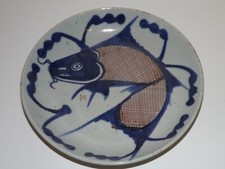 Antico piatto carpa saltante
