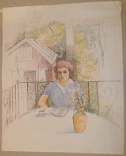 Donna seduta all'esterno