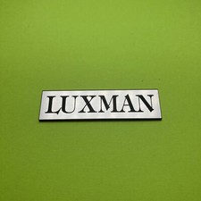 LUXMAN 55x15mm emblema brusch