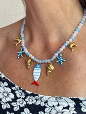 Collana donna in Acciaio dorato con palline colorate e 7 Charm stile marino