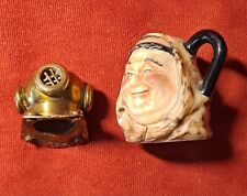 Oggettistica Antica.Brocchetta con monaco,4cm,e casco da palombaro in ottone,2cm