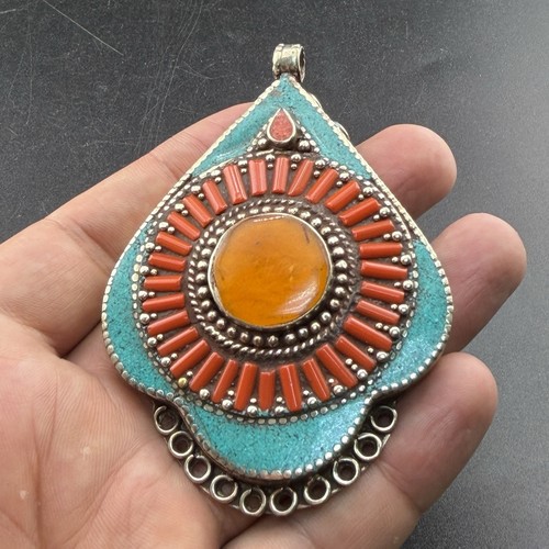 Ciondolo tibetano forma - a,