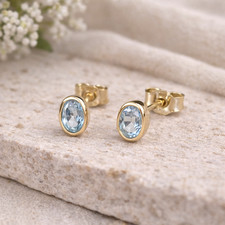 Orecchini oro 333 topazio blu