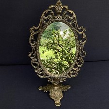 SPECCHIO OVALE BASCULANTE