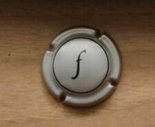 F - CAPSULA DEL TAPPO