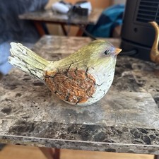 Statuina uccellino invecchiato