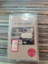 TOM PETTY - WILDFLOWERS. MC