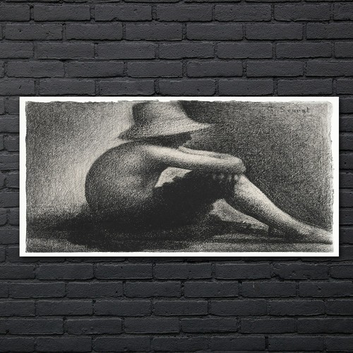 Seated boy with straw hat