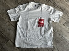 T-shirt media con tasca