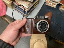 MACCHINA FOTOGRAFICA ANALOGICA FERRANIA in buone condizioni con flash e custodie