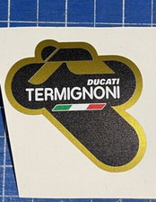 Adesivo Stickers TERMIGNONI resistente al calore 6 cm SX NERO DUCATI oro