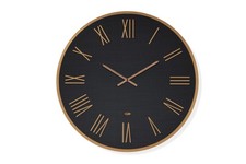 Orologio moderno tondo in gres Kerlite effetto trapunta nero e dettagli in rame 