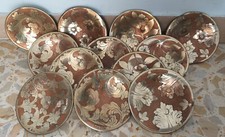 Set 12 piattini antichi in rame e argento (?) cesellato con decorazione floreale